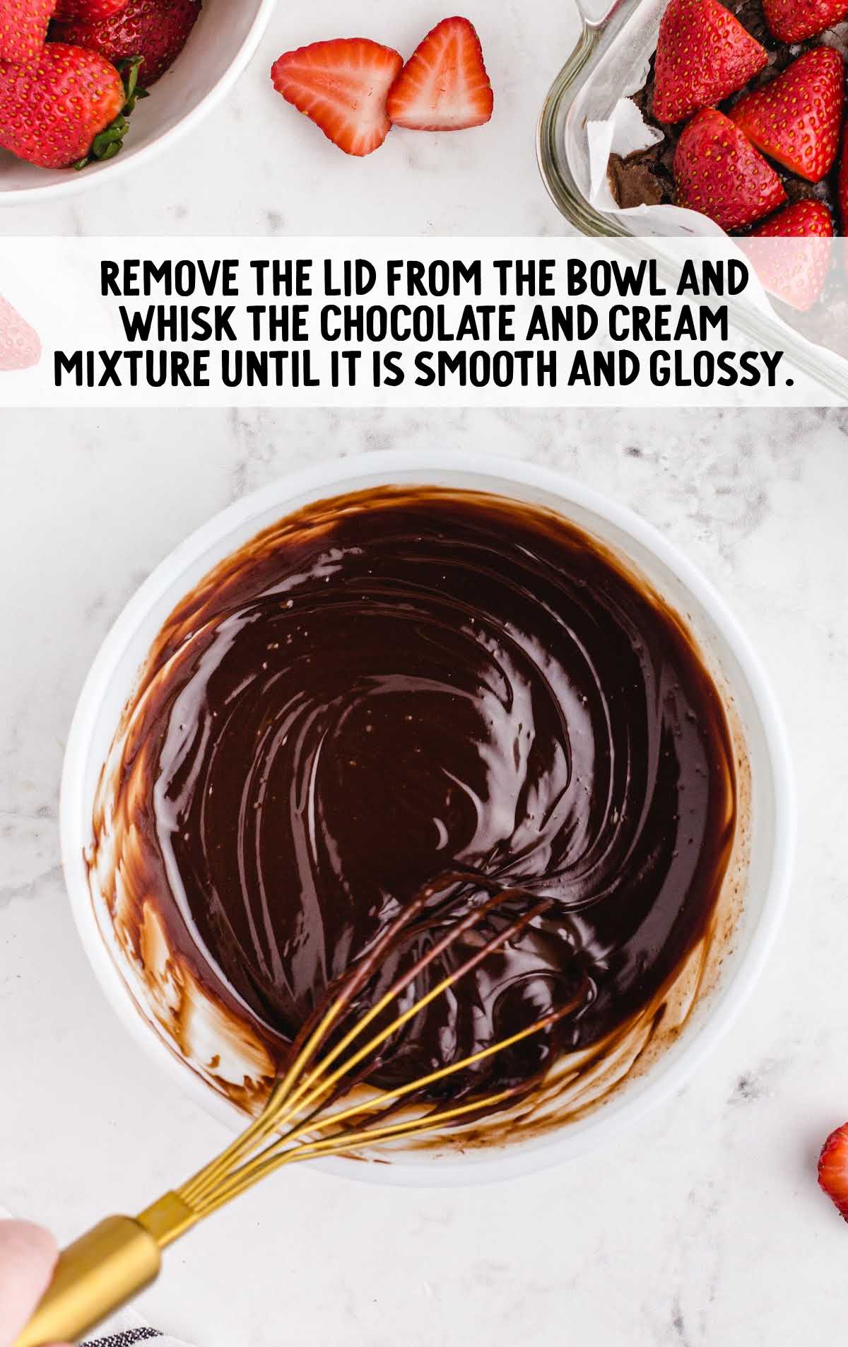 chocolate and cream mixture whisked together in a bowl