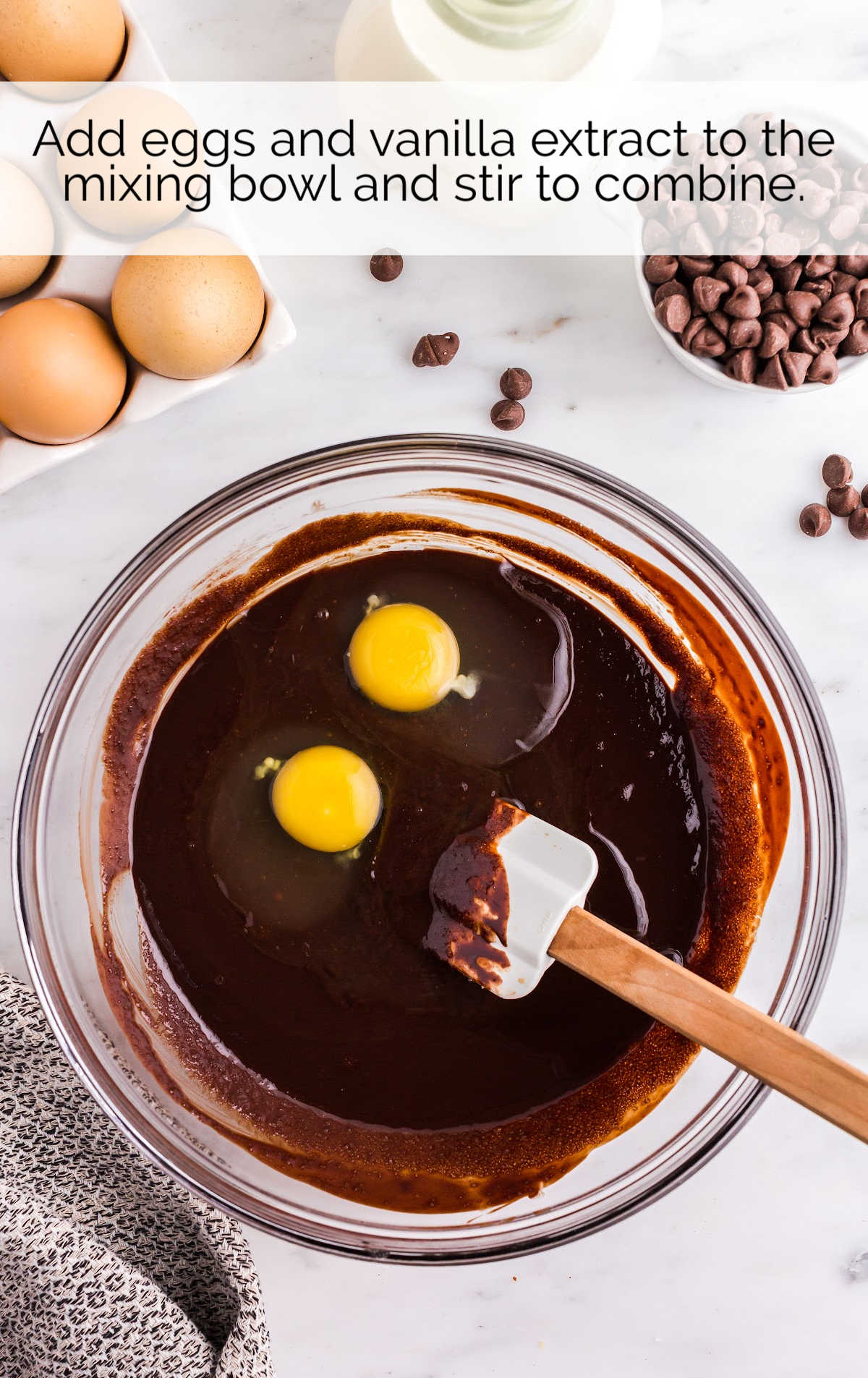 eggs and vanilla added to the bowl of chocolate mixture 