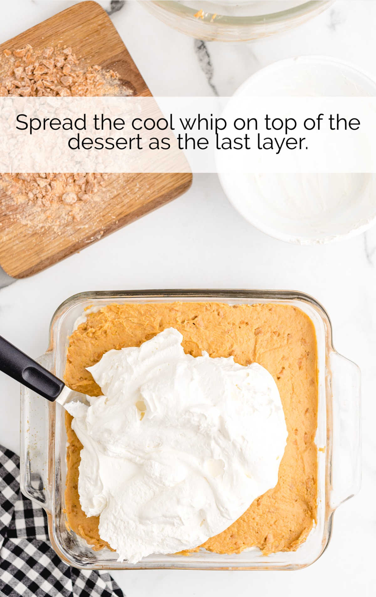 cool whip spread on top of the pudding mixture