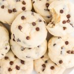 close up overhead shot of cookies topped with chocolate chips on a plate