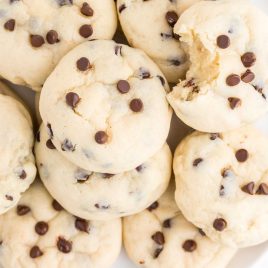 close up overhead shot of cookies topped with chocolate chips on a plate