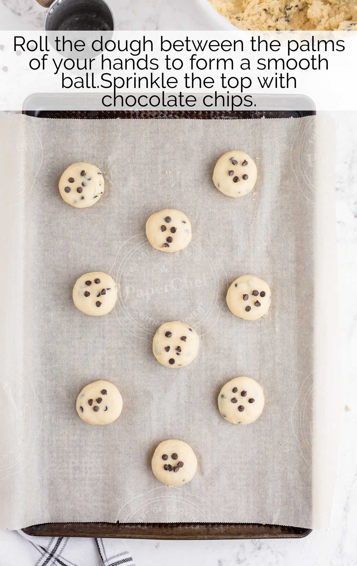 cookie dough topped with sprinkled on a parchment lined baking sheet