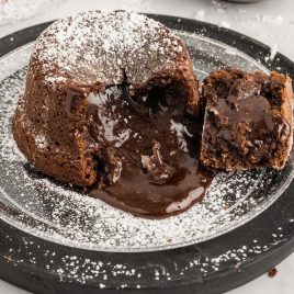 close up shot of a Chocolate Lava Cake sprinkled with powdered sugar