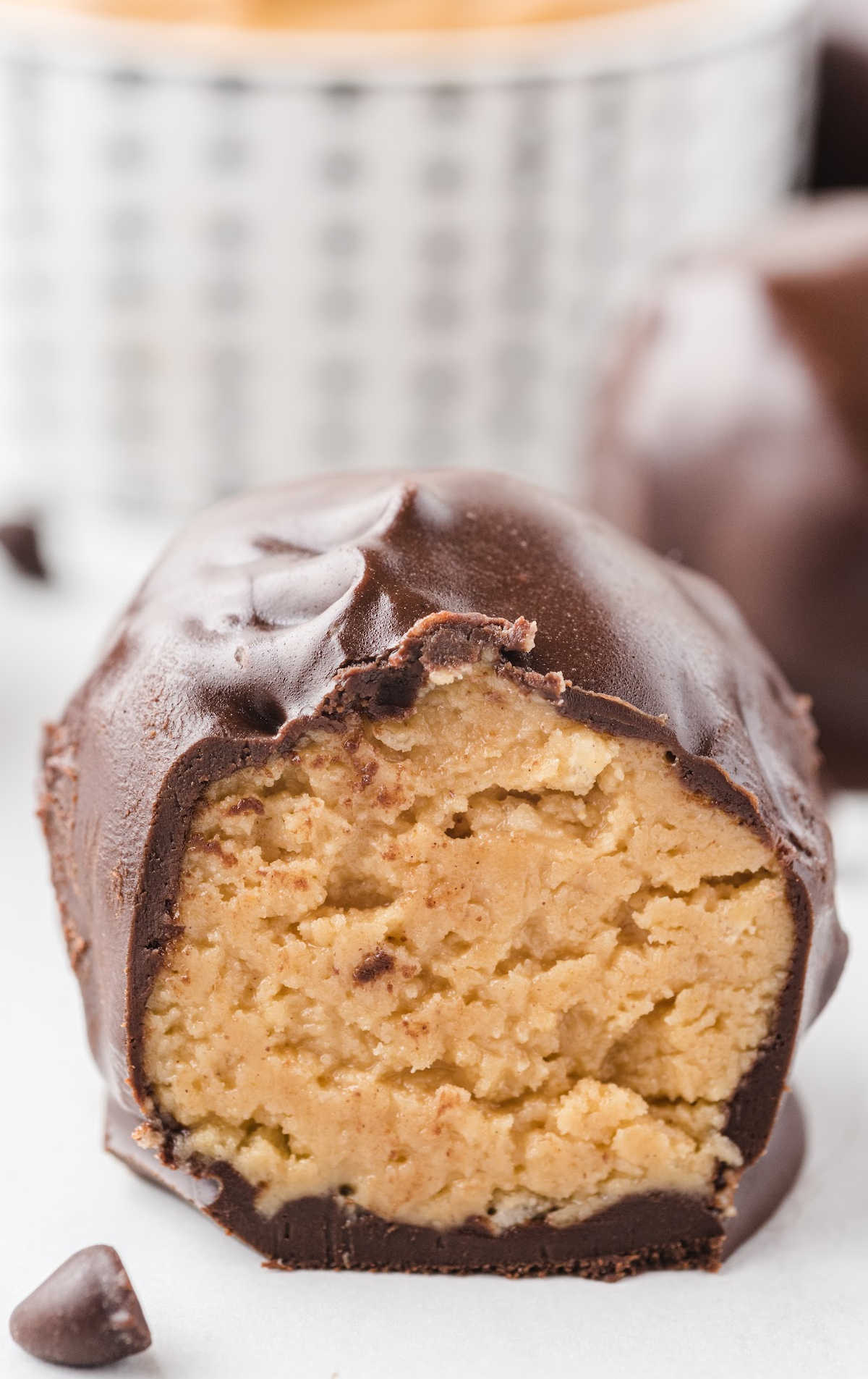 close up shot of a Peanut Butter Balls showing the inside peanut butter layer