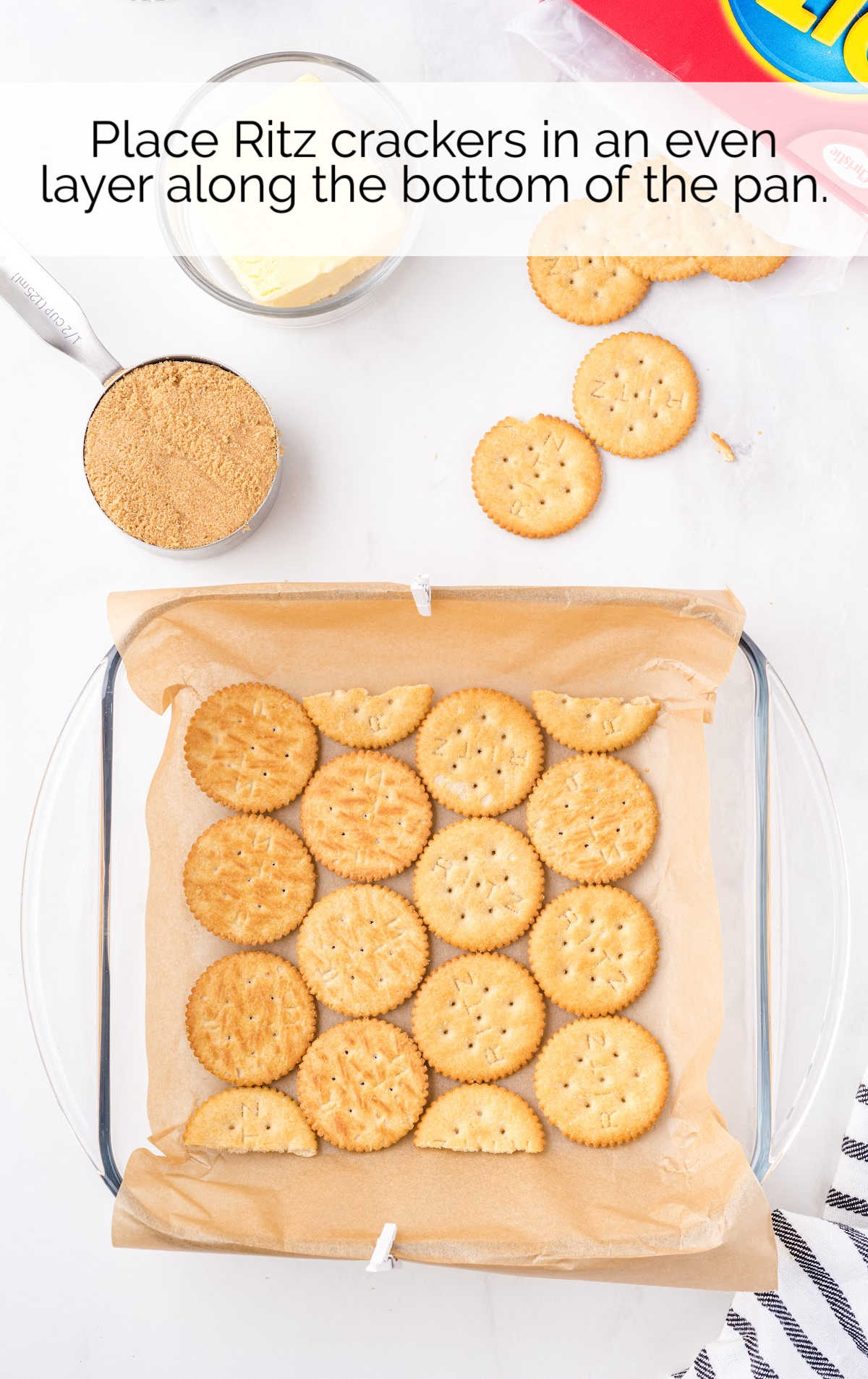 ritz crackers placed at the bottom of a pan
