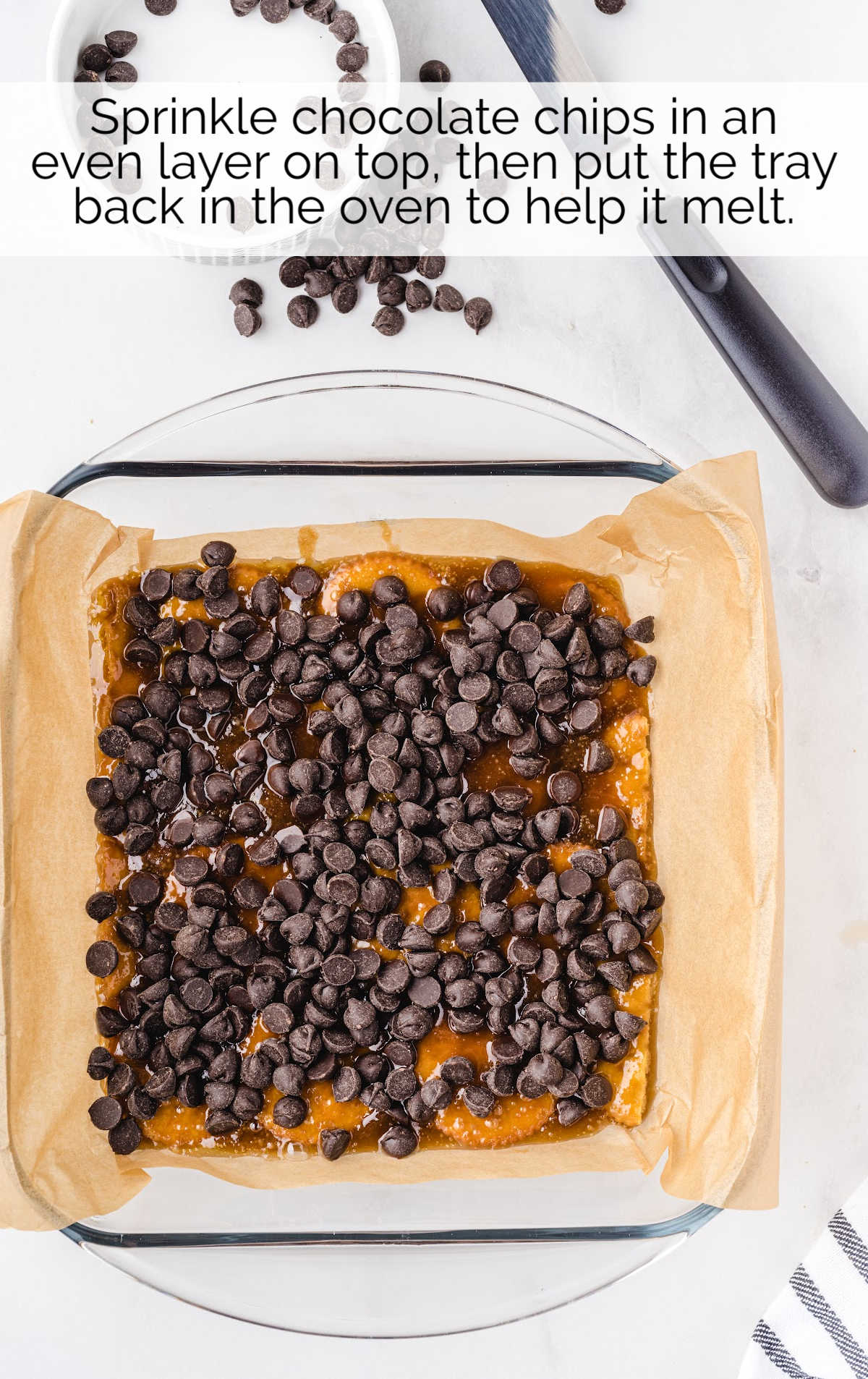 chocolate chips sprinkled on top of the caramel sauce