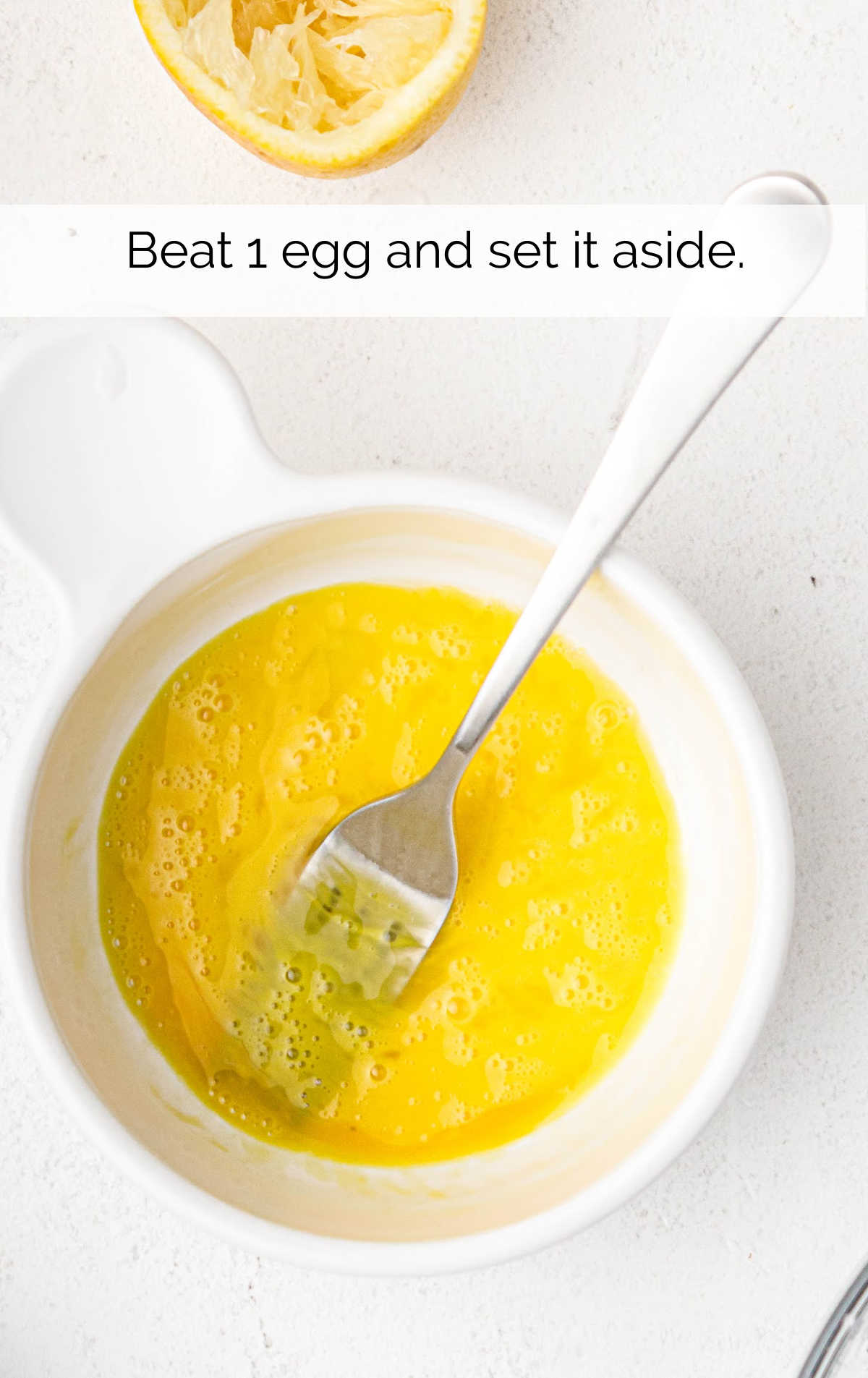 egg beaten in a bowl with a fork