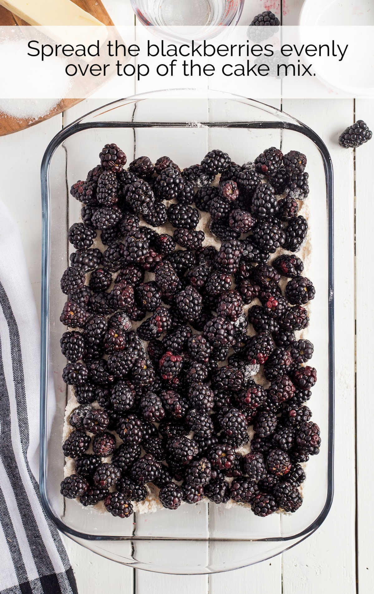 blackberries mixed with cake mix in a baking dish