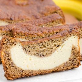 close up shot of slices of Cream Cheese Banana Bread on a parchment line sheet