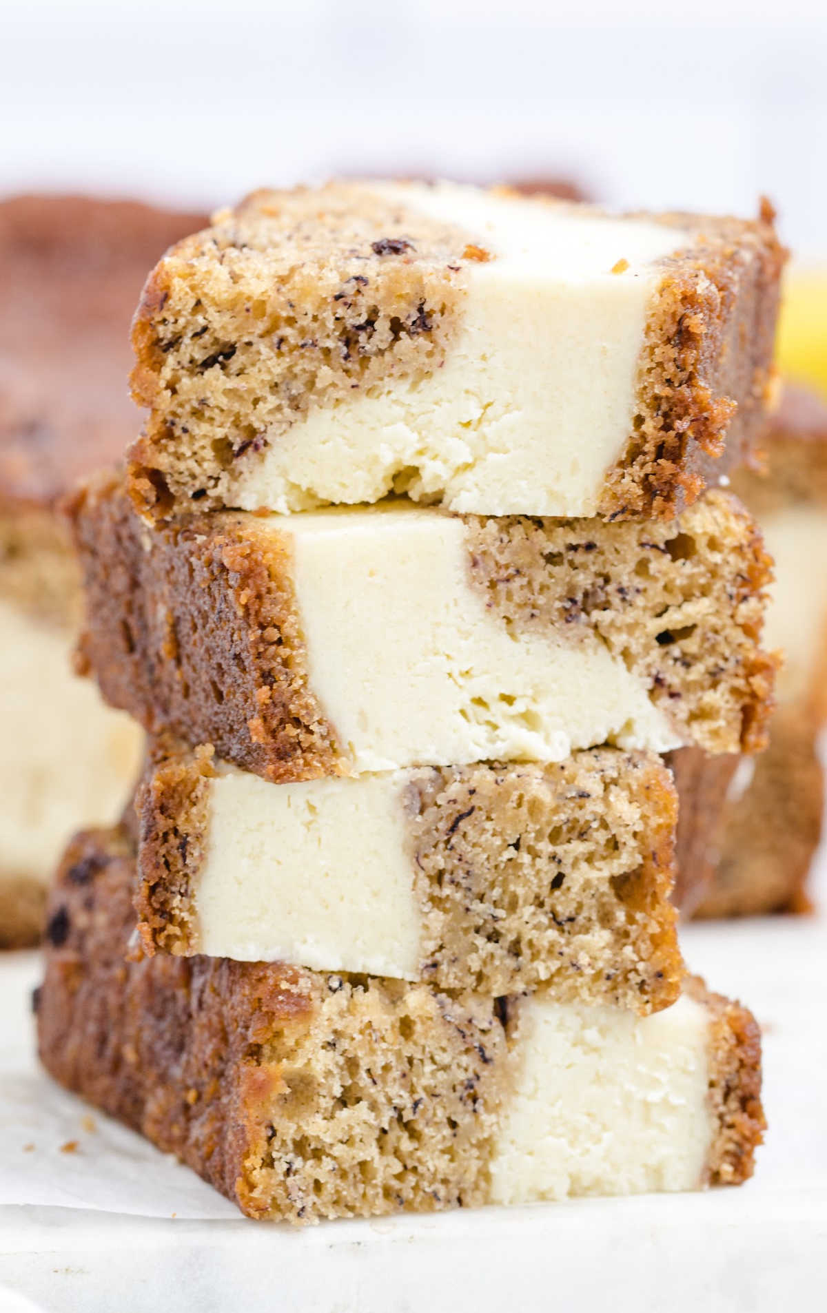 pieces of Cream Cheese Banana Bread stacked on top of each other