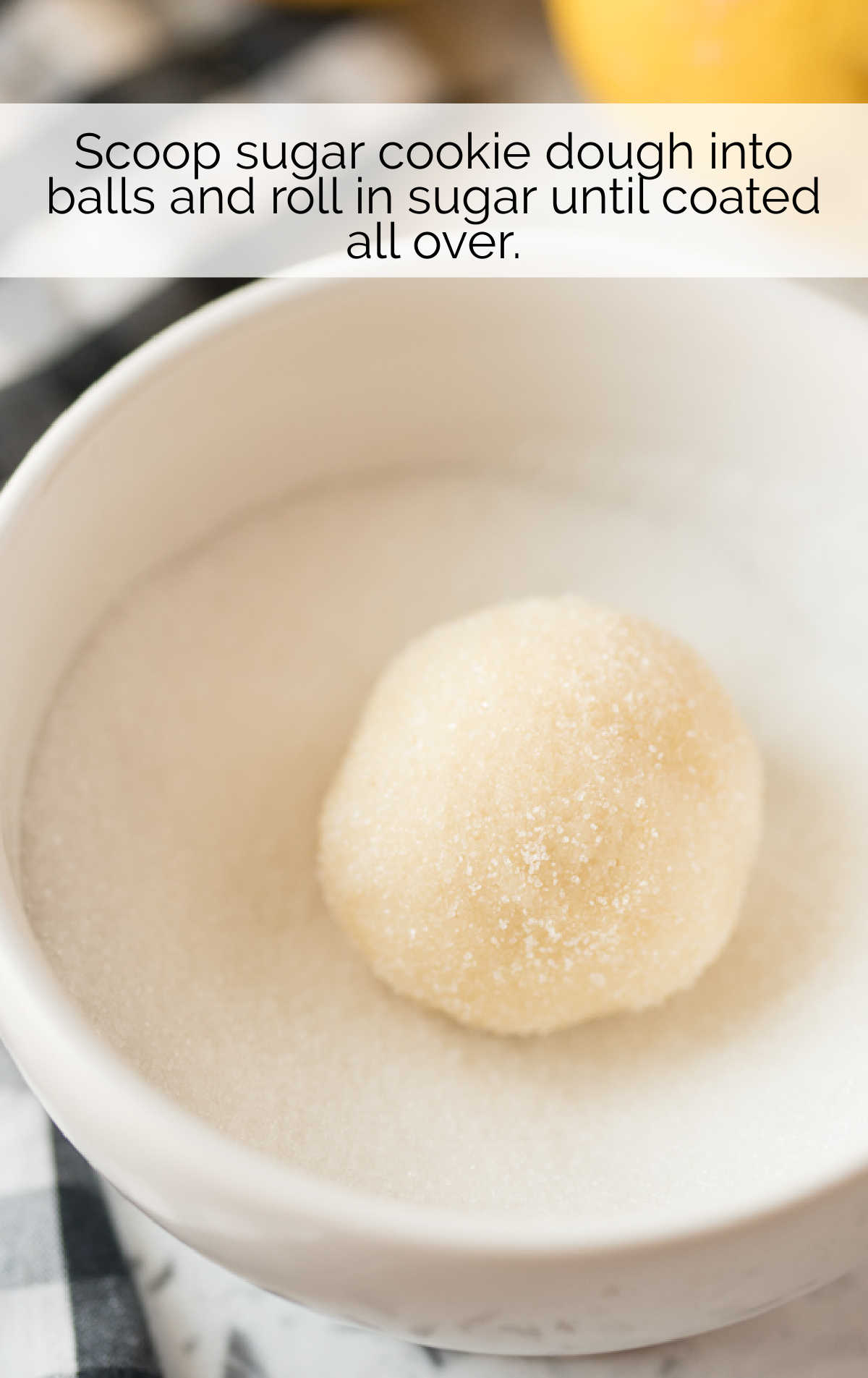 cookie dough balls dipped into a ball of sugar