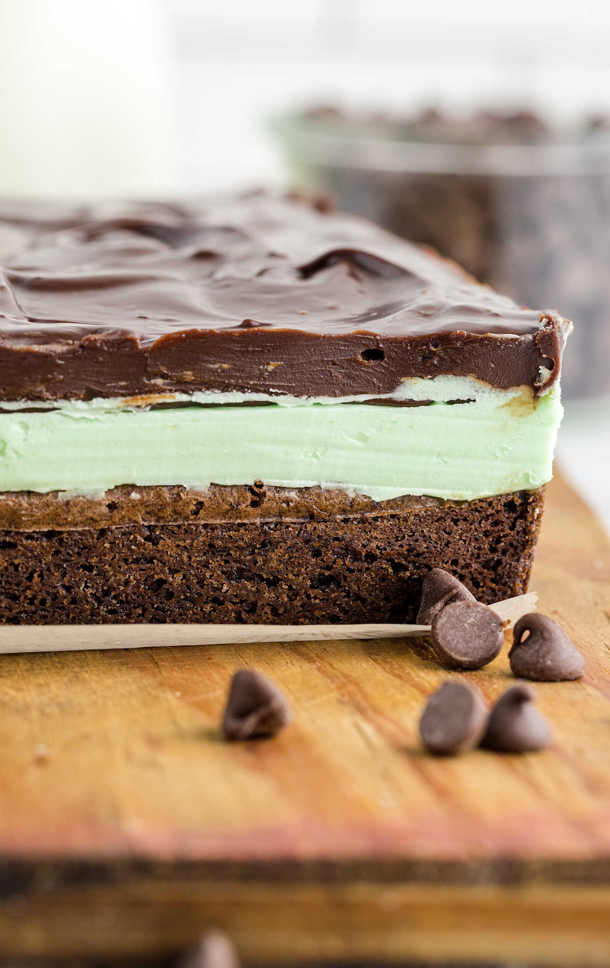 close up shot of a Mint Chocolate Brownies on a wooden board