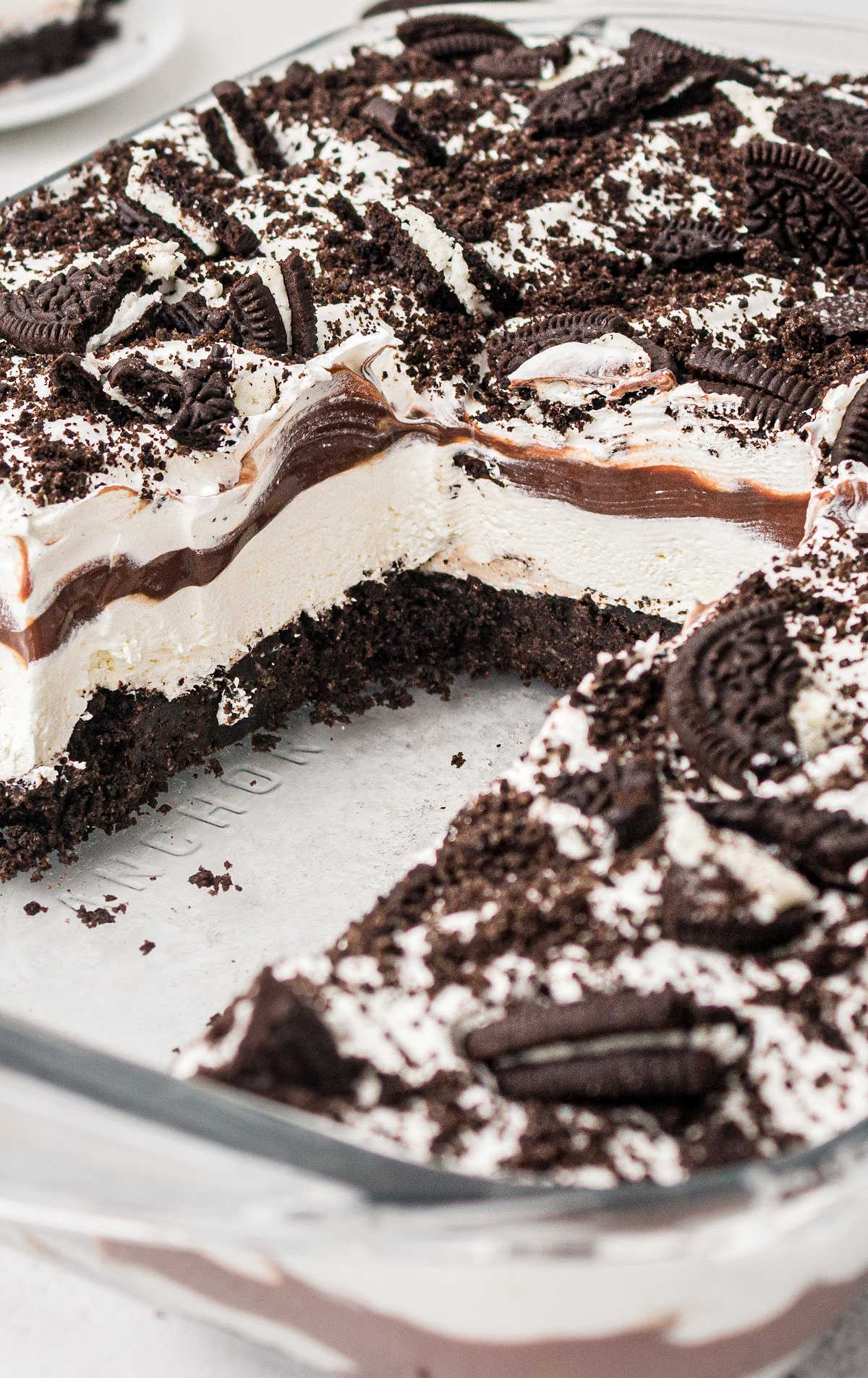 close up shot of Oreo Delight in a baking dish with slices missing
