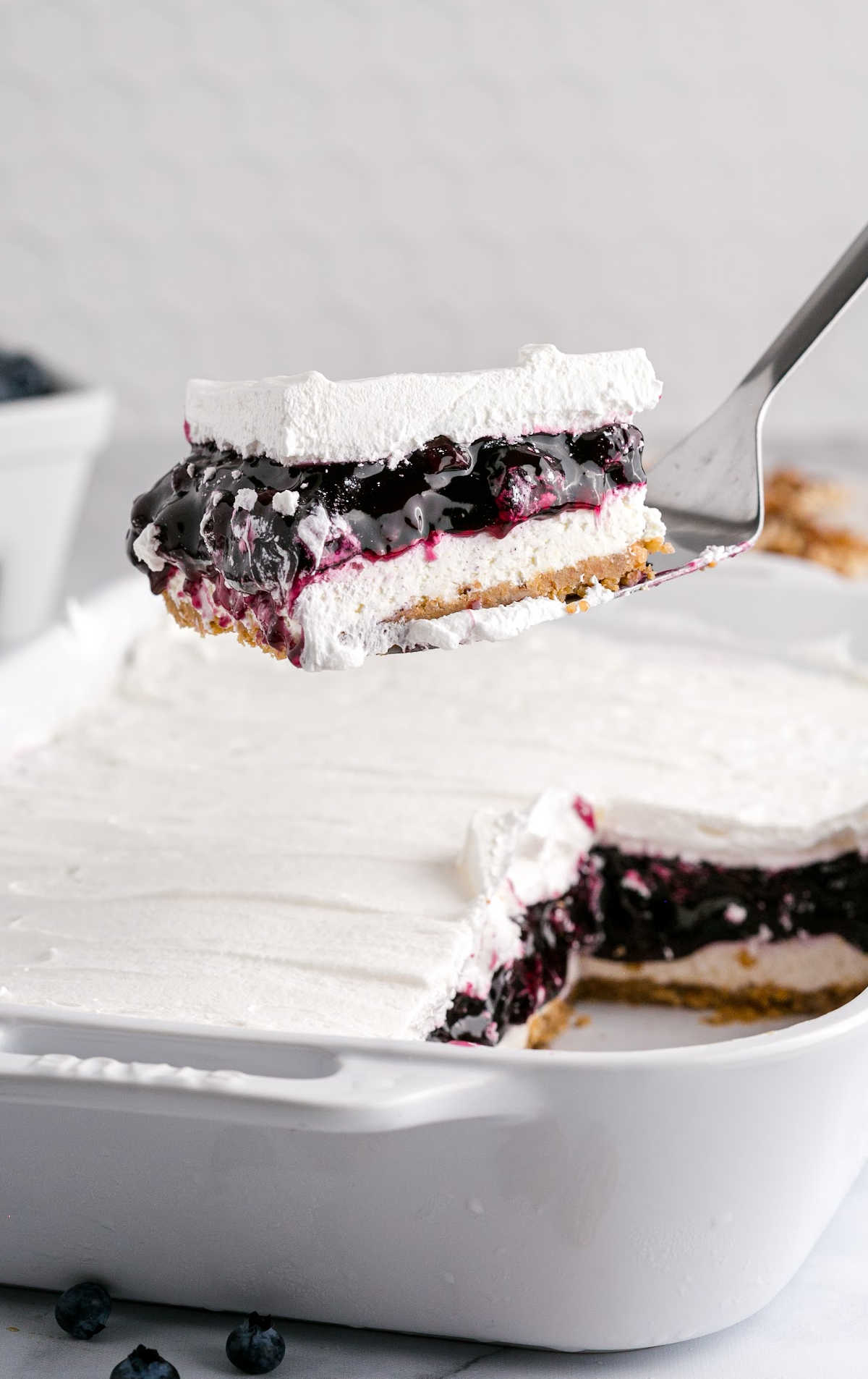 Blueberry Delight on a baking dish and slice of Blueberry Delight on a fork