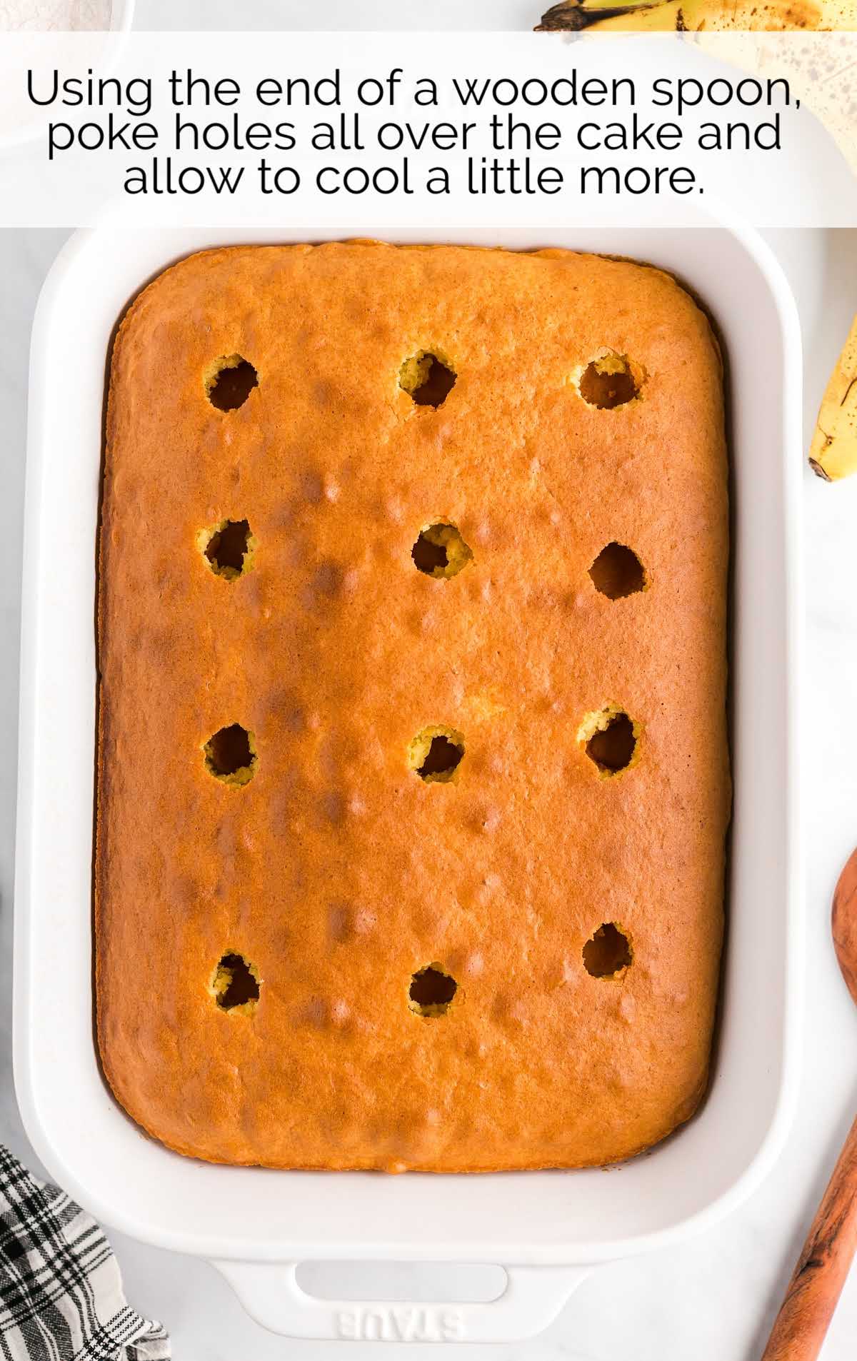 holes poked on the cake in a baking dish