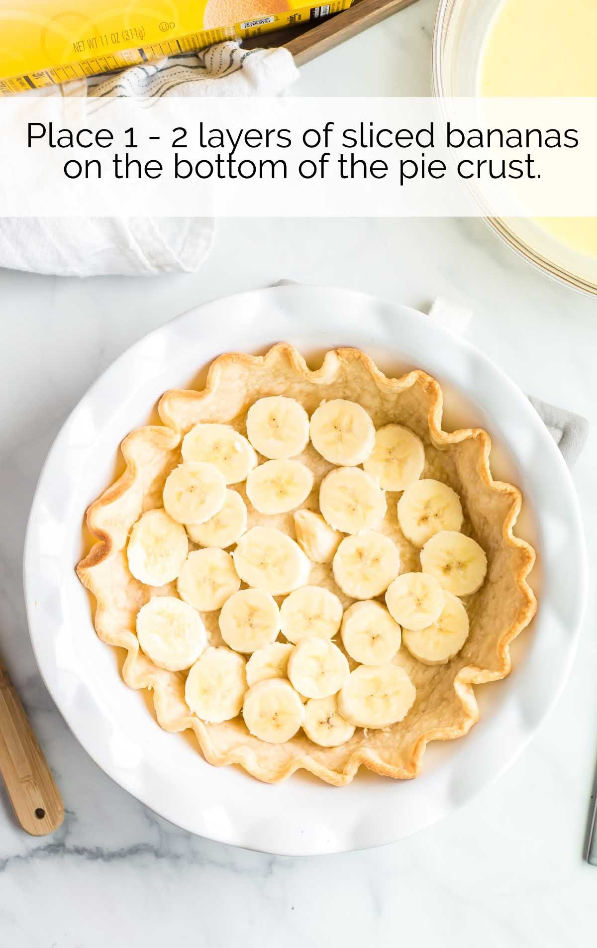 sliced banana added to the pie crust