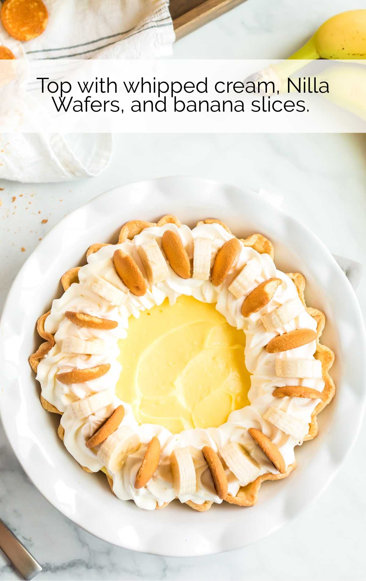 whipped cream, Vanilla wafers and banana slices put on top of the pie