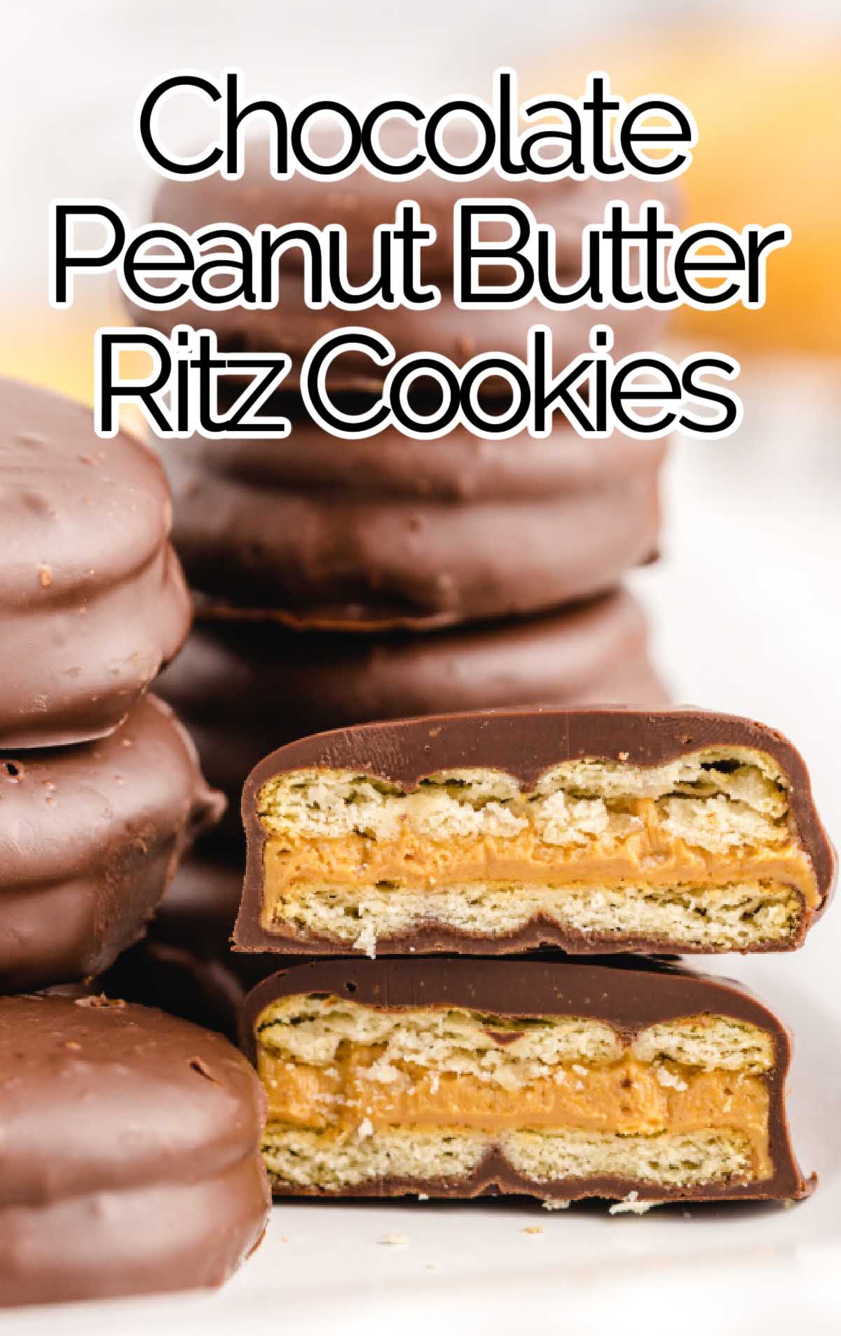 close up shot of a bunch of Chocolate Peanut Butter Ritz Cookies stacked on top of each other and with bite taken out of it