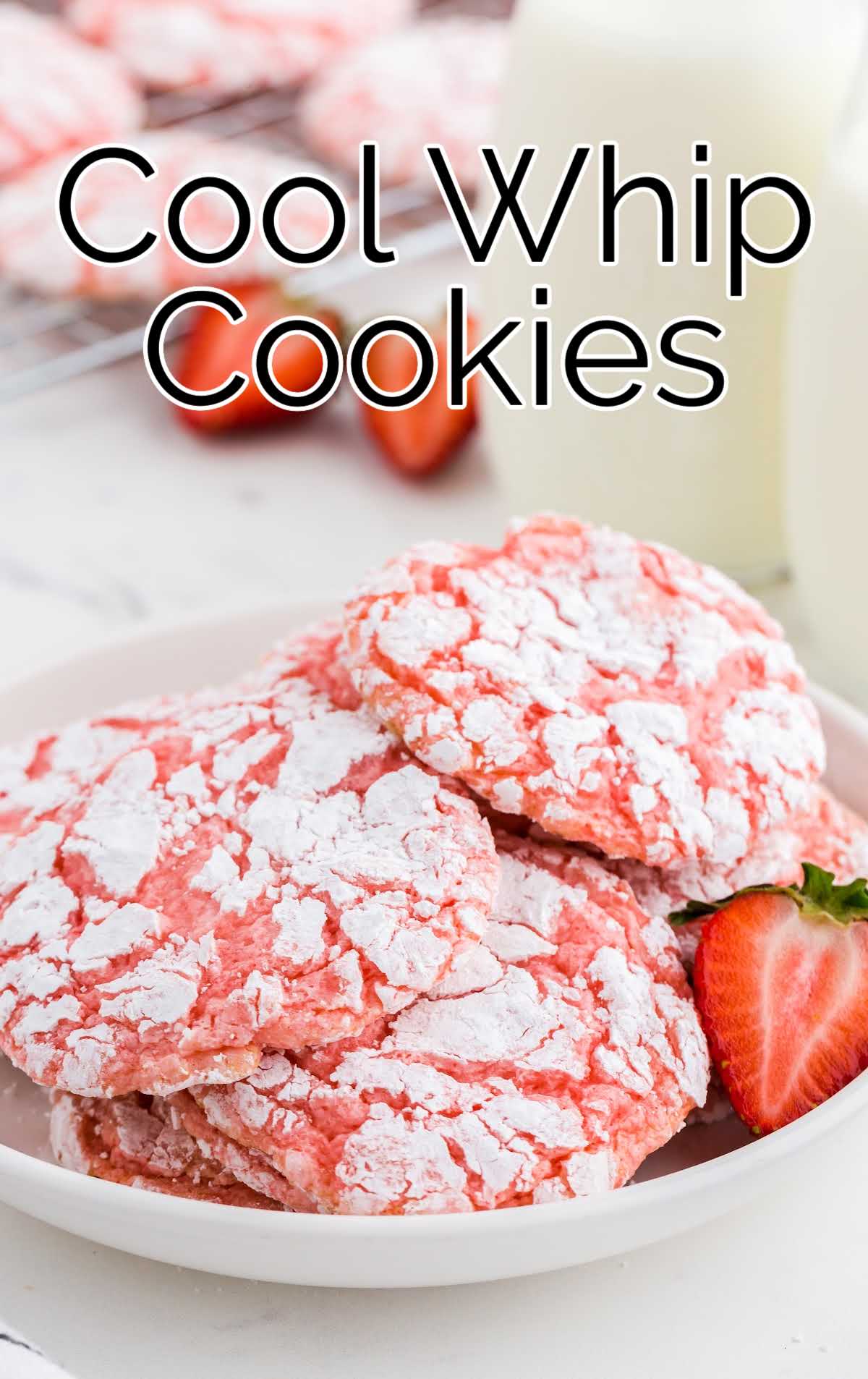 close up shot of Cool Whip Cookies in a plate with a strawberry