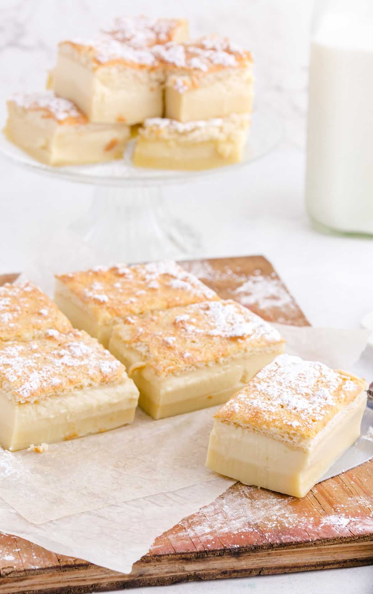 slices of Magic Custard Cake on a wooden board