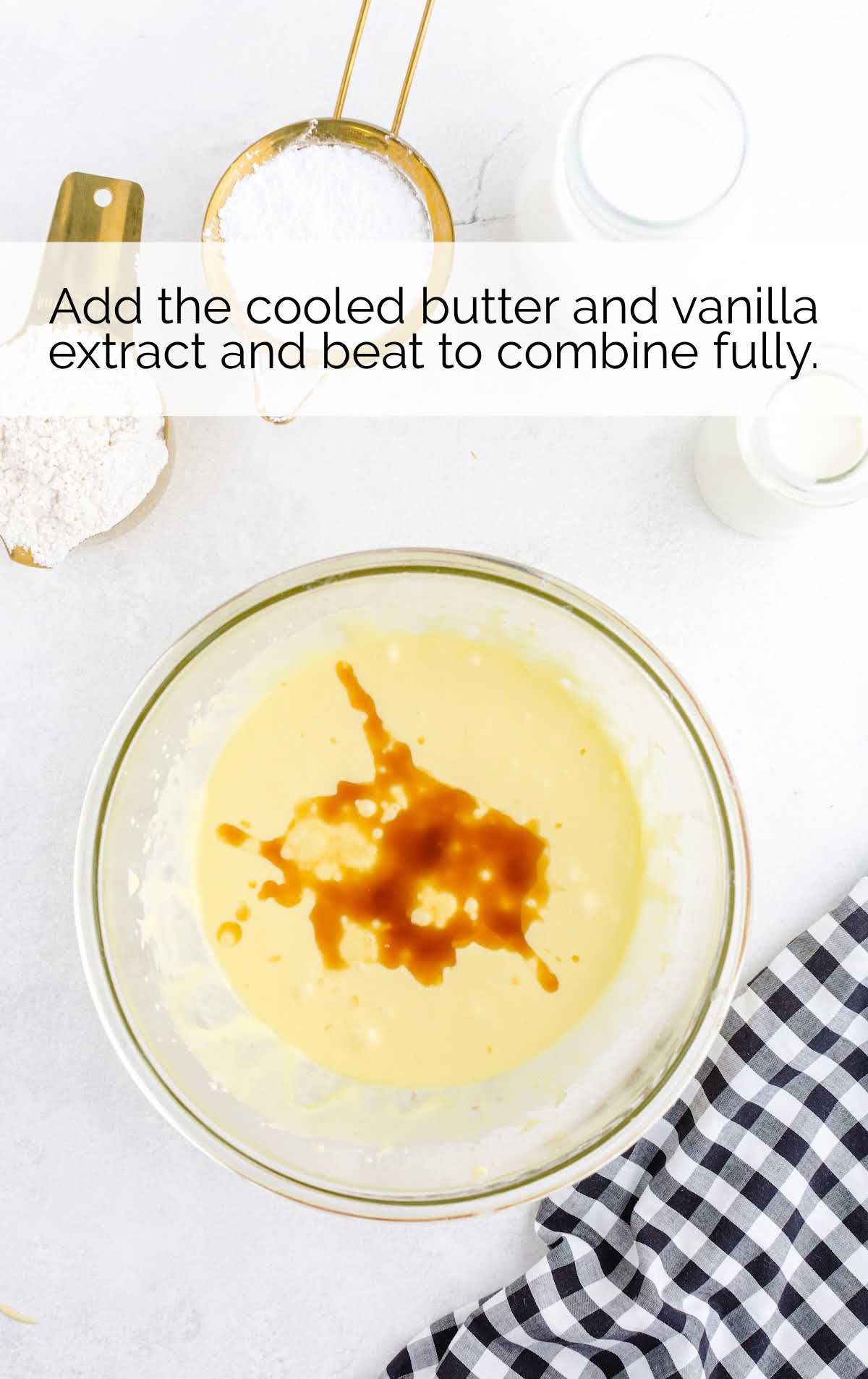 butter and vanilla combined with the egg yolk and sugar mixture in a bowl