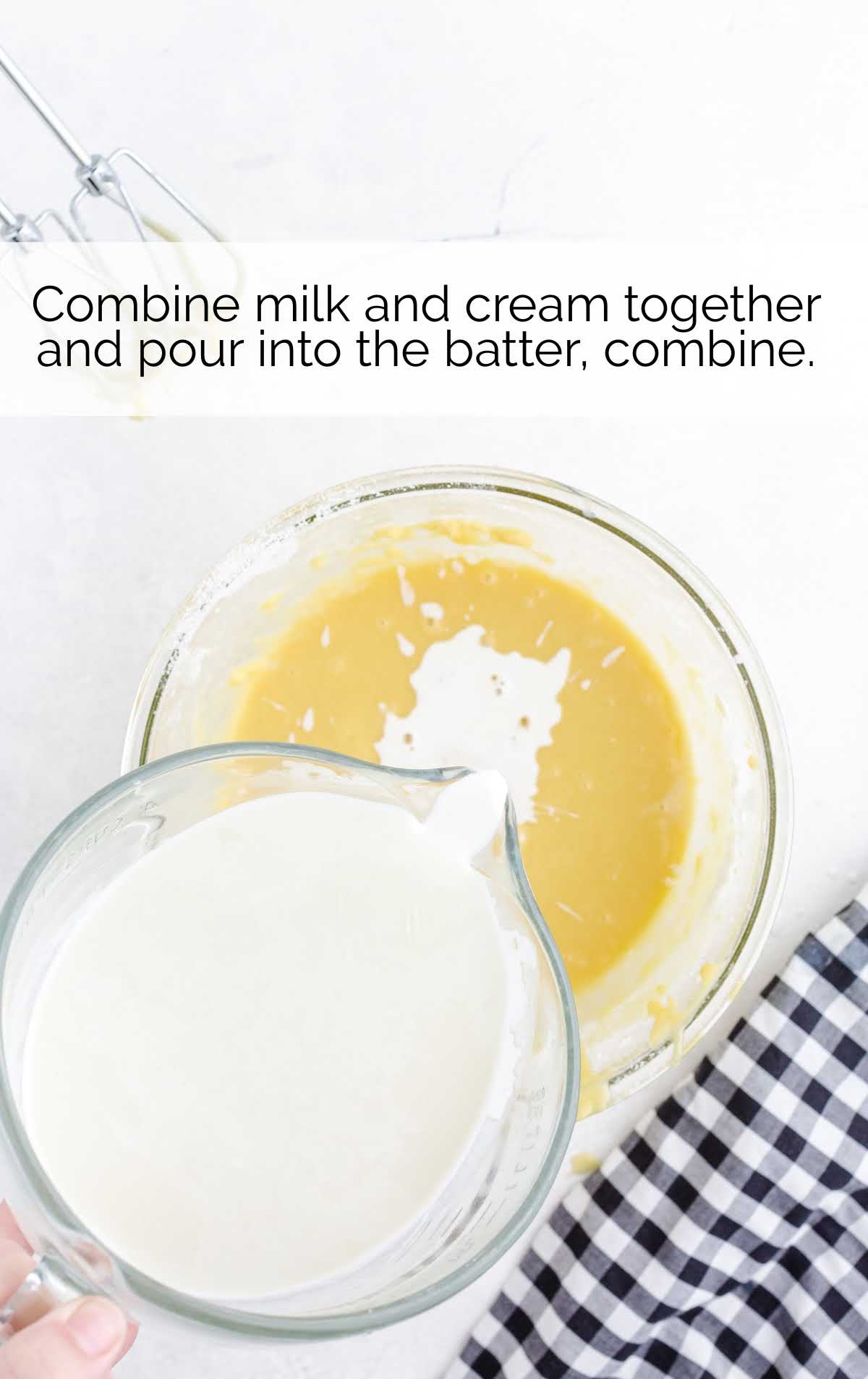 milk and cream combined together in a cup and then poured into the batter