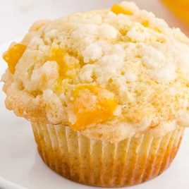 close up shot of a Peach Cobbler Muffin on a plate