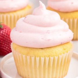 close up shot of Strawberry Cream Cheese Frosting on a cupcake