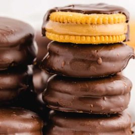 close up shot of a bunch of Chocolate Peanut Butter Ritz Cookies stacked on top of each other