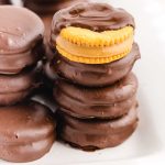 close up shot of a bunch of Chocolate Peanut Butter Ritz Cookies stacked on top of each other