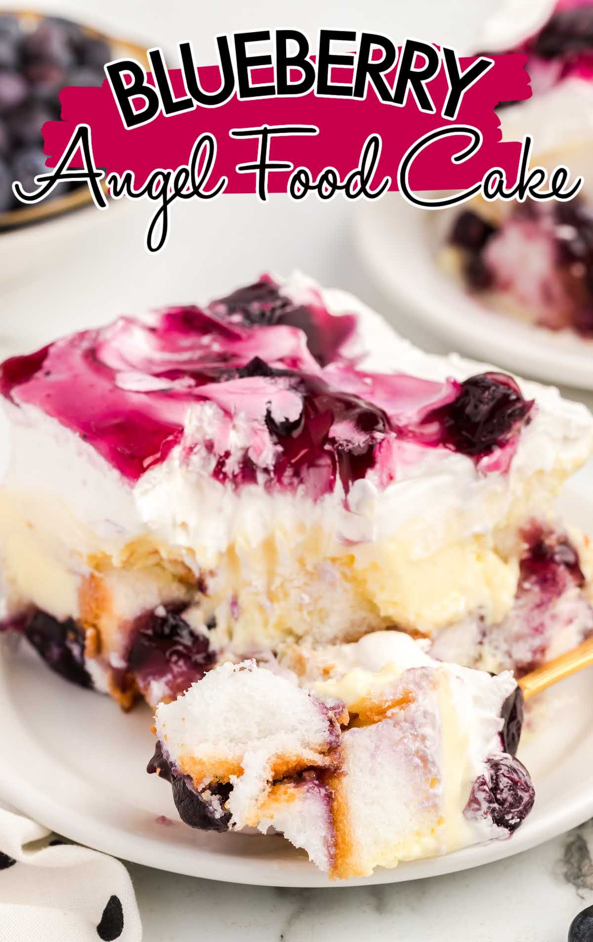 close up shot of a slice of Blueberry Angel Food Cake on a plate