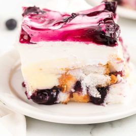 close up shot of a slice of Blueberry Angel Food Cake on a plate