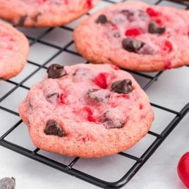 close up shot of Cherry Chocolate Chip Cookies on a cooling rack