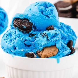 close up shot of Cookie Monster Ice Cream with Oreos and Chip Ahoy cookies in a cup