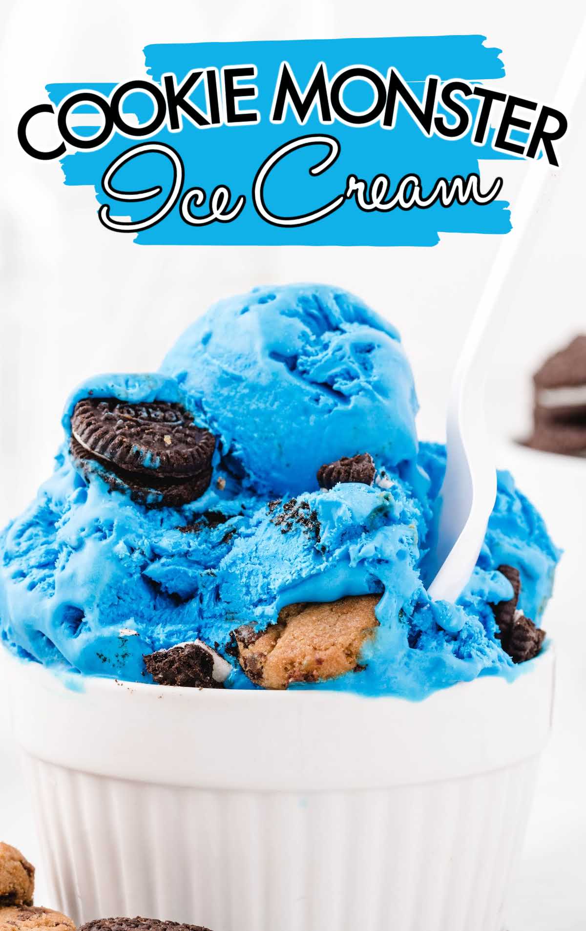 close up shot of Cookie Monster Ice Cream with Oreos and Chip Ahoy cookies in a cup with a spoon