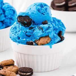 close up shot of Cookie Monster Ice Cream with Oreos and Chip Ahoy cookies in a cup