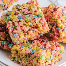 close up shot of Fruity Pebbles Treats stacked on top of each other on a plate