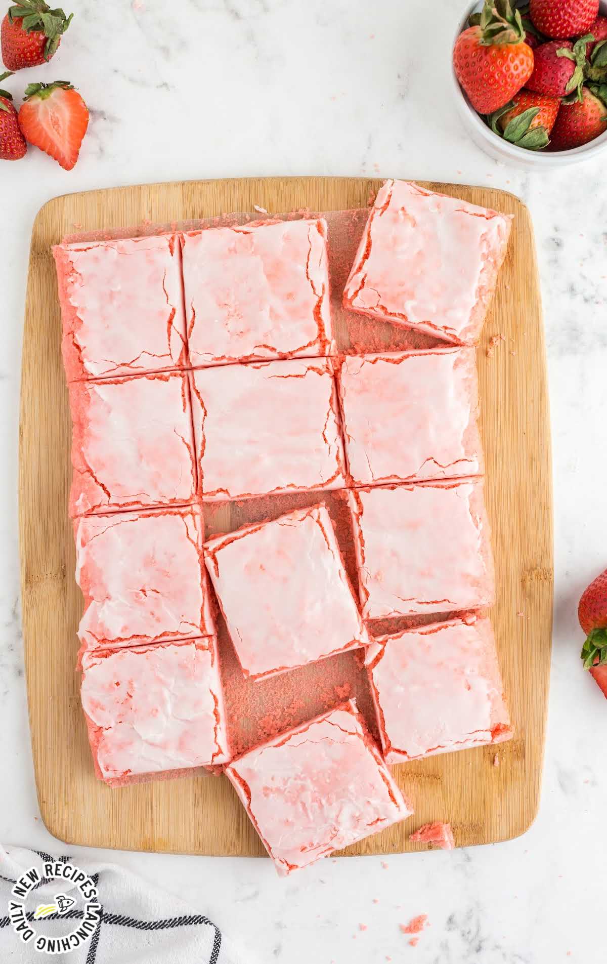 overhead shot of Strawberry Brownies on a wooden cutting board
