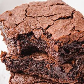 close up shot of Ooey Gooey Chocolate Brownies stacked on top of each other