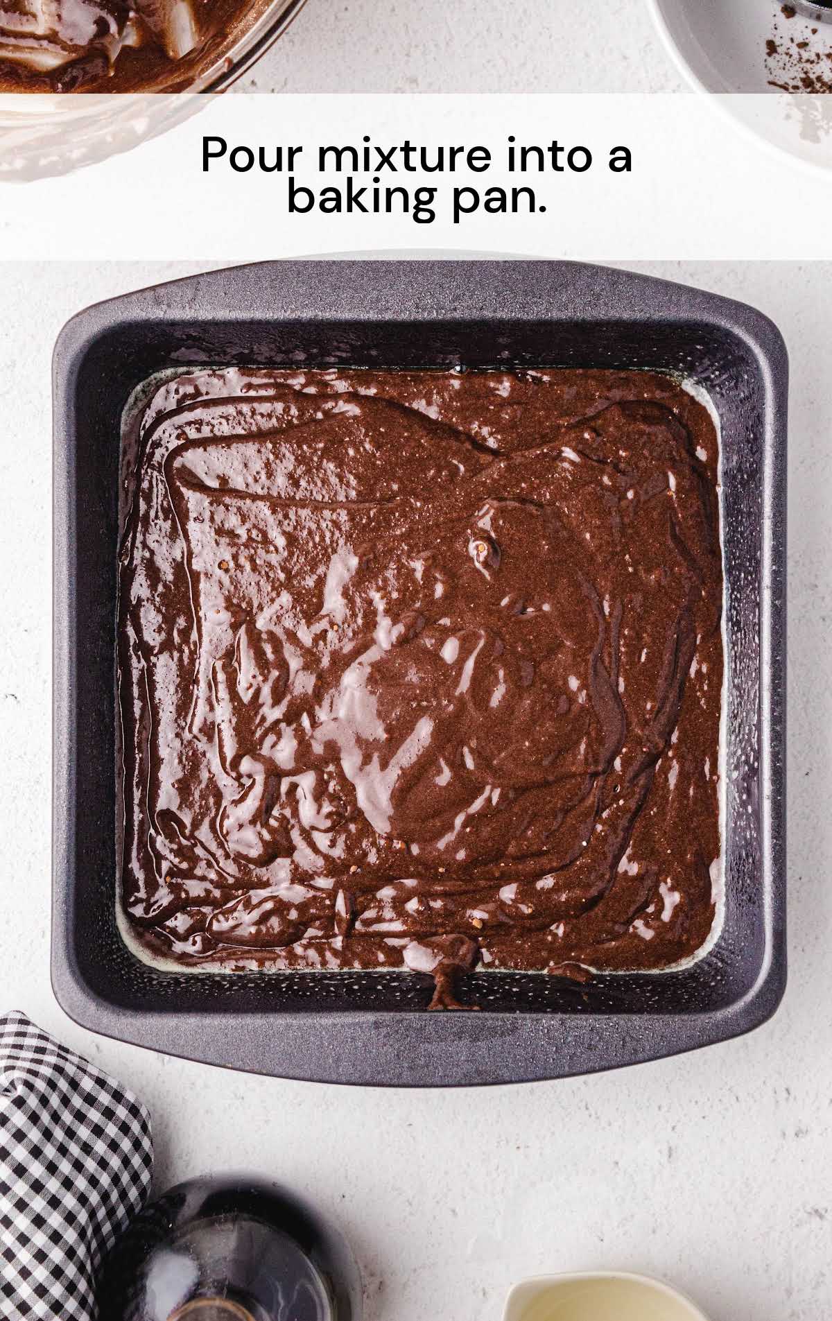Ooey Gooey Chocolate Brownies mixture poured in a baking dish