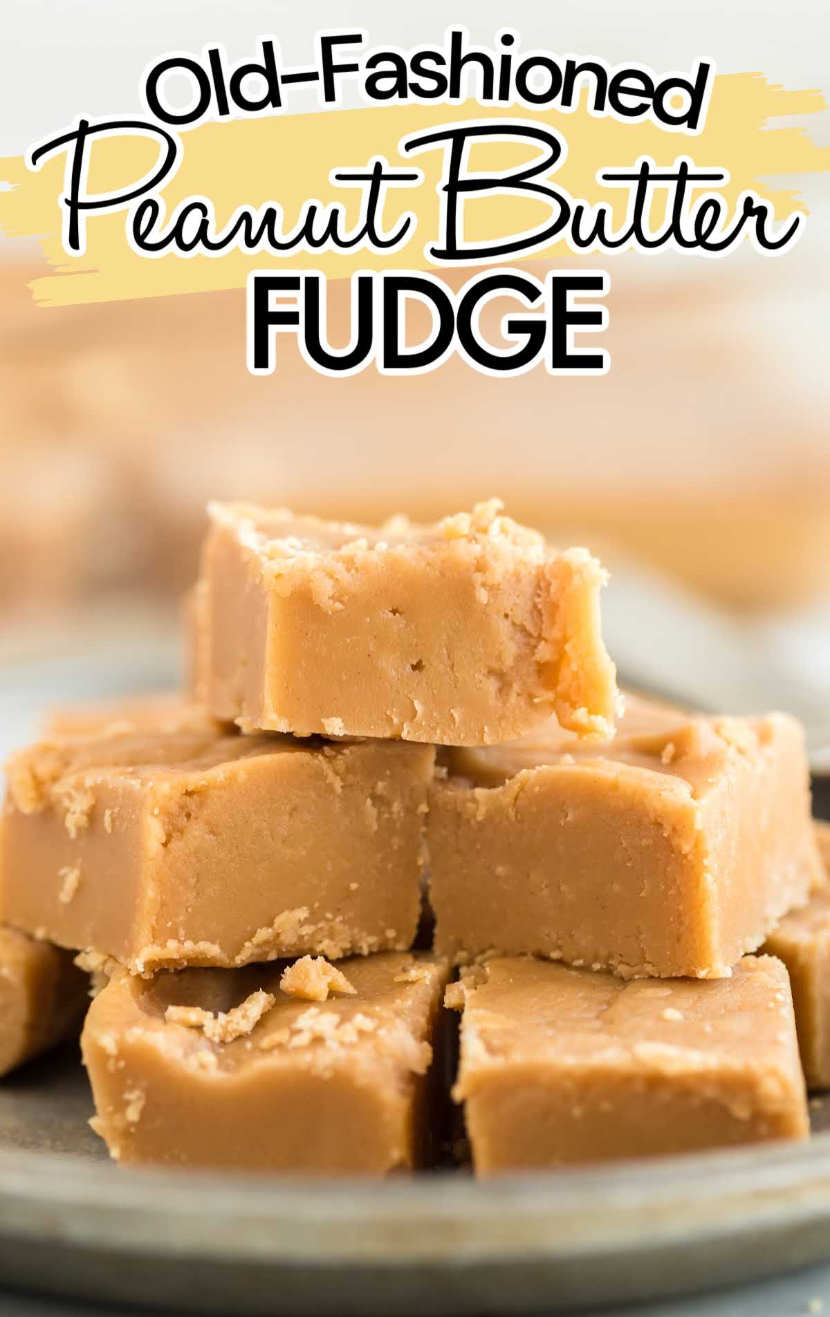 close up shot of pieces of Old Fashioned Peanut Butter Fudge stacked on top of each other