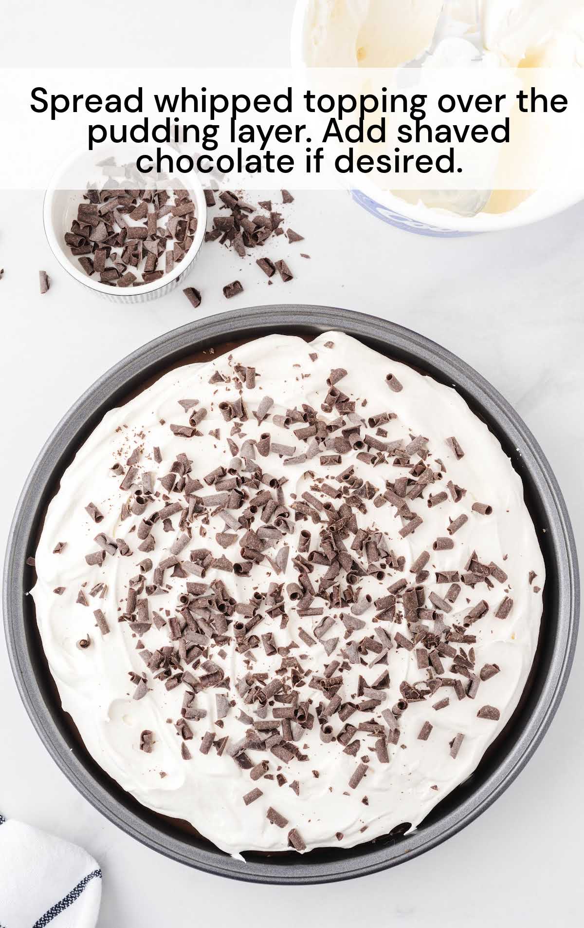 whipped topping spread over the pudding layer and shaved chocolate if desired in a baking dish
