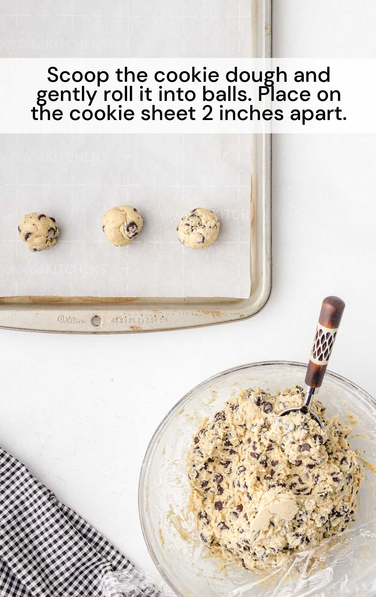 cookie dough scooped and rolled into a ball and placed in a baking pan
