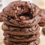 close up shot of Double Chocolate Chip Cookies stacked on top of each other