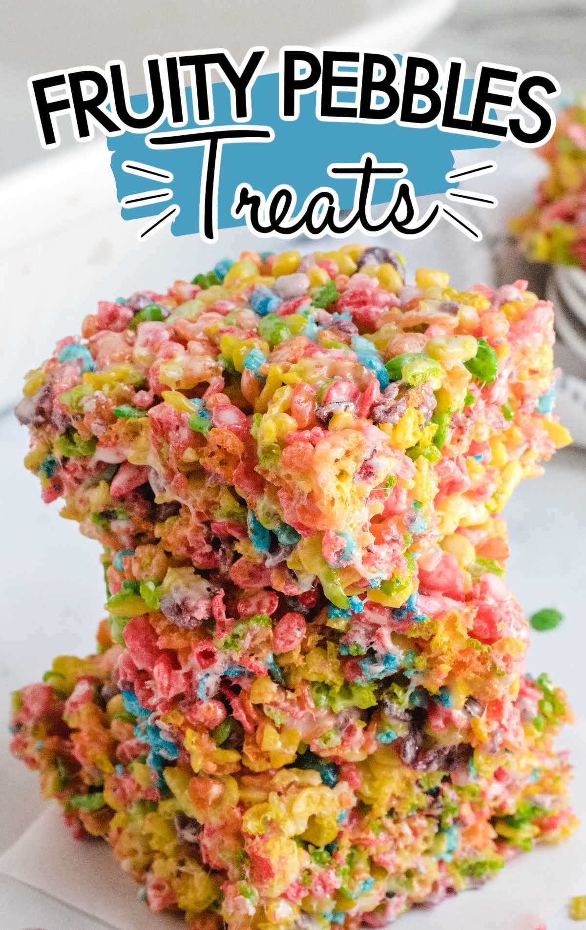 close up shot of Fruity Pebbles Treats stacked on top of each other on a napkin
