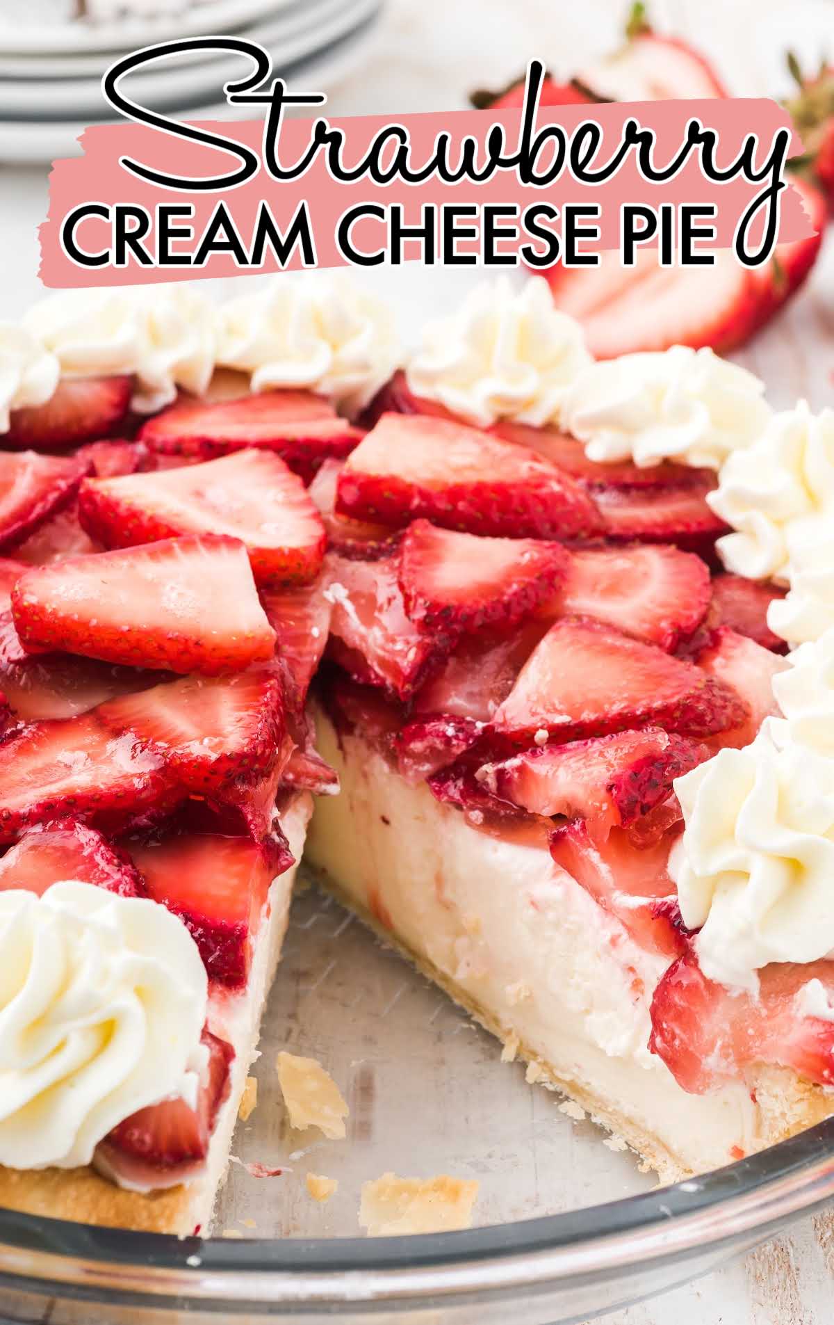 a close up shot of Strawberry Cream Cheese Pie in a glass bowl with a slice taken out