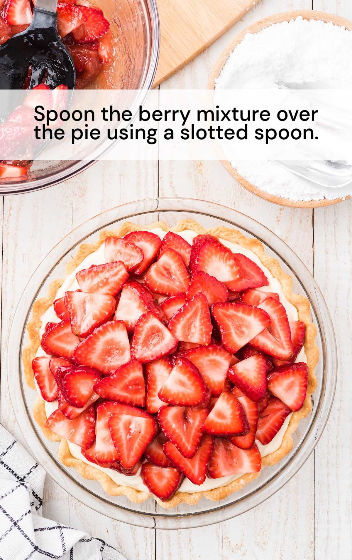 strawberry mixture spooned on top of the pie in a glass bowl