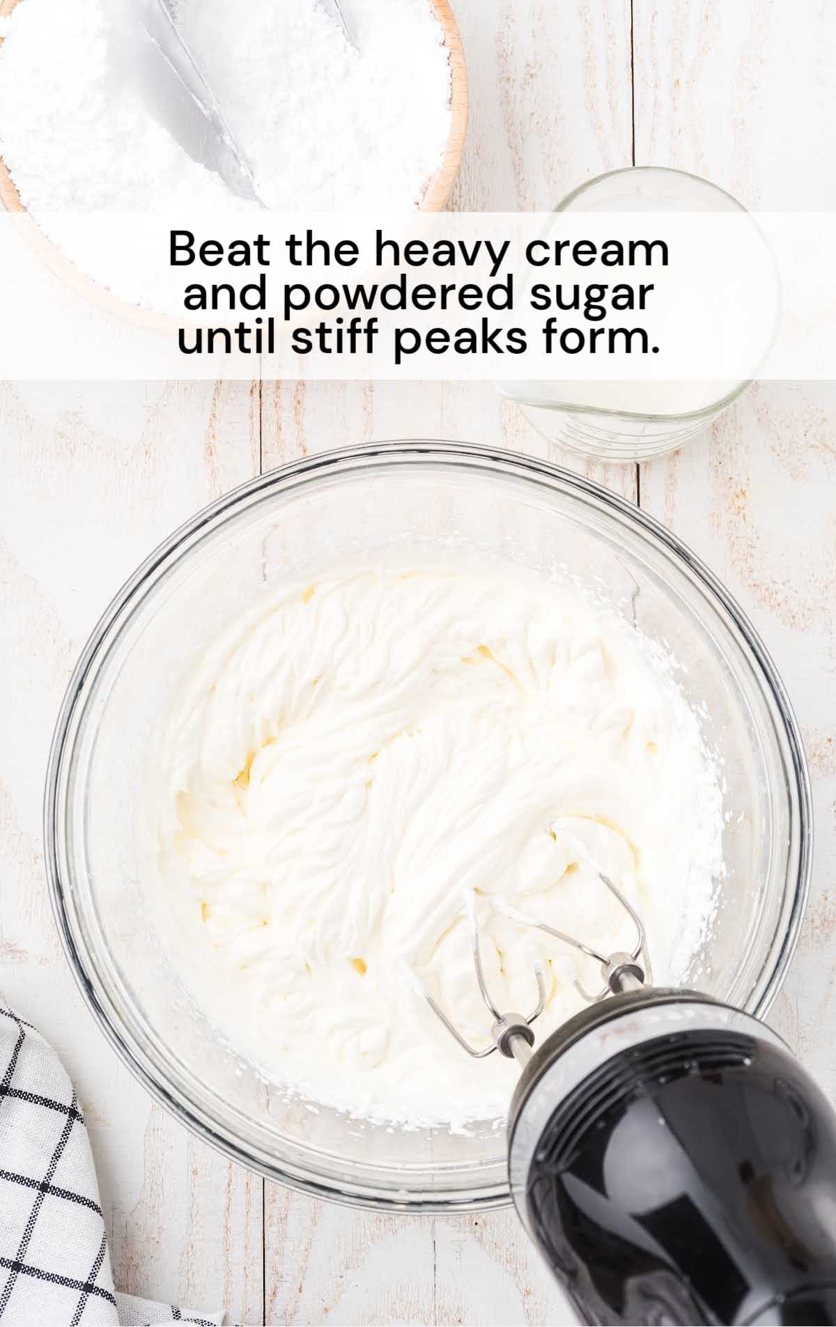 heavy cream and powdered sugar blended together in a bowl